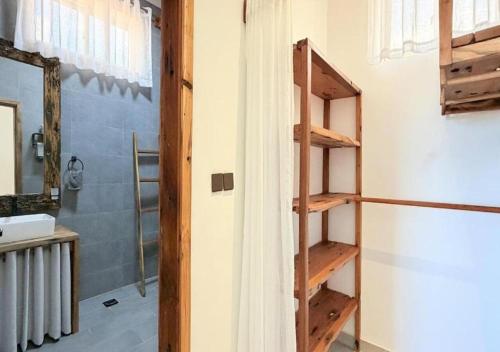 a bathroom with a shower and a sink at Zanziland Apartments in Kiwengwa
