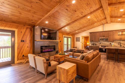 a living room with a couch and a table at Deer Valley in Elk Park