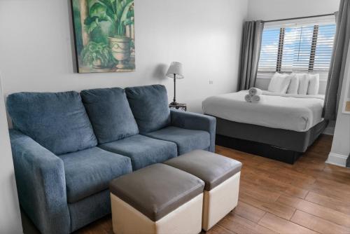 a living room with a couch and a bed at The Palace 2306 in Myrtle Beach