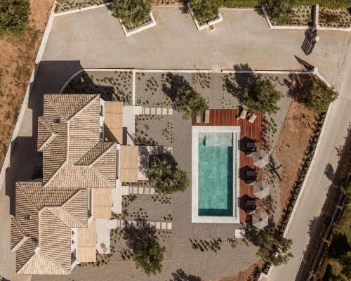an aerial view of a house with a swimming pool at Levante Afitos Suites - Adults Only in Afitos