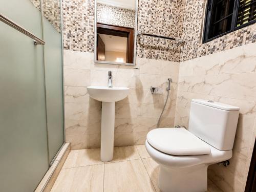 a bathroom with a toilet and a sink at Fadars Place in Sagisa