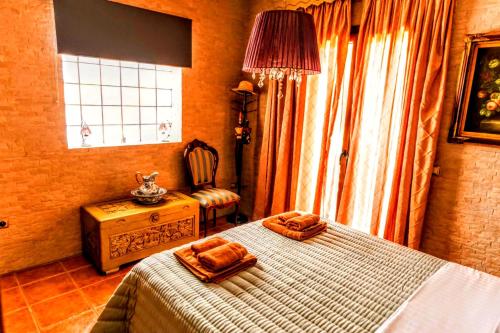 a bedroom with a bed with two towels on it at VillaAnna in Keratea
