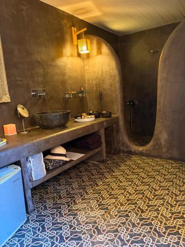 a bathroom with a sink and a counter with a tub at Ellie Villa Seaside Koufonisi in Nisída Koufonísion