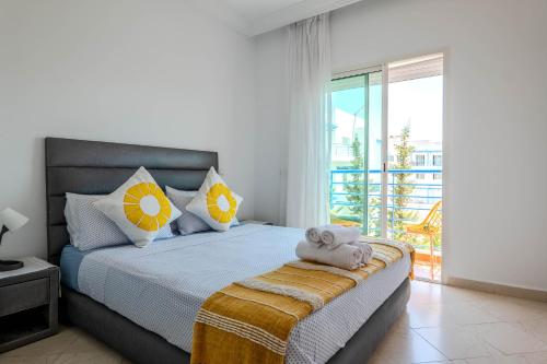a bedroom with a large bed with a balcony at Brisa Marina Cabo in Cabo Negro