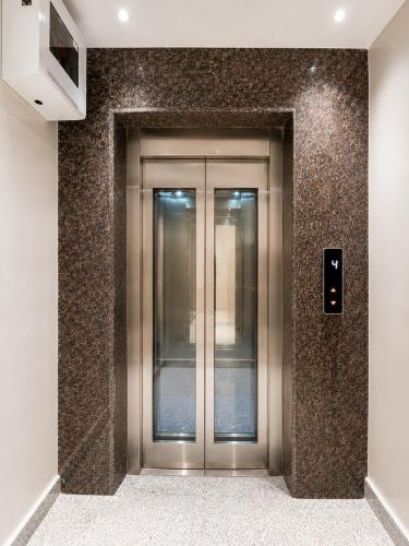 a elevator in a building with a metal door at The Bay Suites - NIS in kolkata