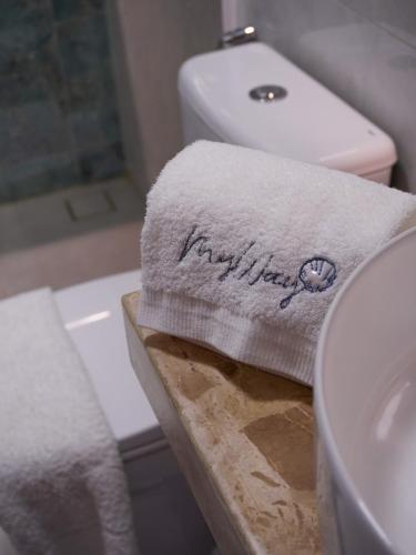 a bathroom with a towel that says happy birthday at My Way Flat in Aracati