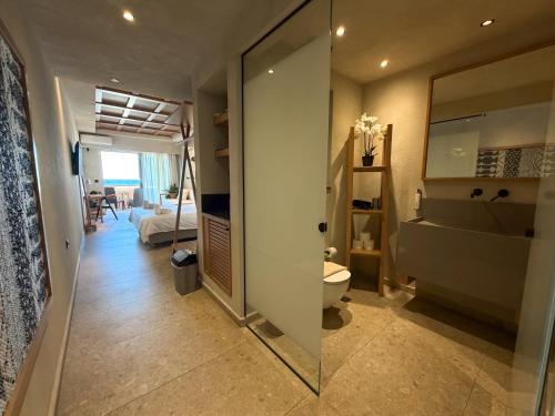 a bathroom with a toilet and a sink and a tub at Ariadne Beach in Platanias