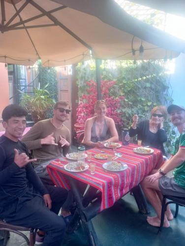 a group of people sitting around a table at Il Riposo in Arequipa