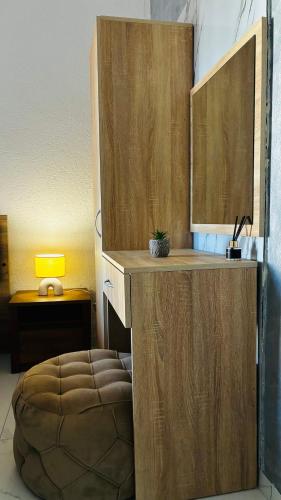 a room with a wooden counter with a ottoman at Ulcinj apartments in Ulcinj