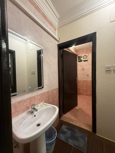 a bathroom with a sink and a shower at مساكن المبيت 5 new in Abha