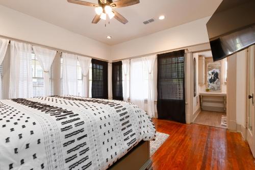 a bedroom with a bed and a ceiling fan at Uptown Merchant in Abilene