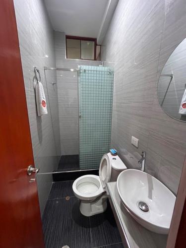 a bathroom with a toilet and a sink and a shower at casa sol de sauce in Sauce