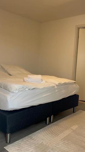 a bed sitting in a room with at Ilulissat City Apartments- Apartment 2 in Ilulissat