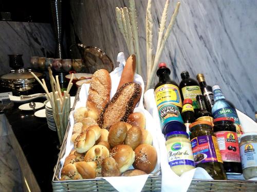 a basket filled with bread and some bottles of beer at THE WAY Dhaka in Dhaka