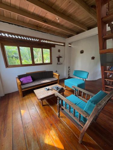 a living room with a couch and a table at Intimunay Shala Yoga Center in Las Núñez
