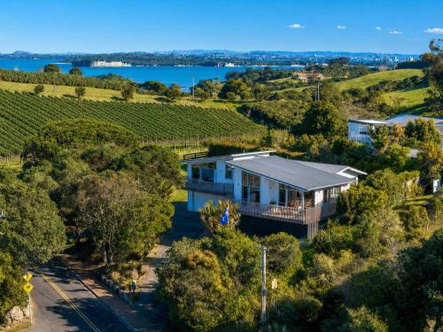 an aerial view of a house in a vineyard at Oneroa Vines and Views- Stay Waiheke in Blackpool