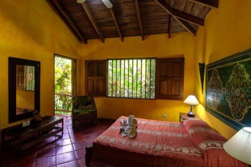 Krevet ili kreveti u jedinici u okviru objekta Hotel La Palapa Eco Lodge Resort