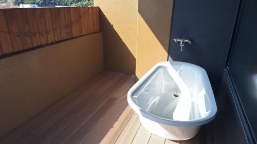 a bathroom with a urinal in the corner of a room at Yutorelo Yamaga in Yamaga