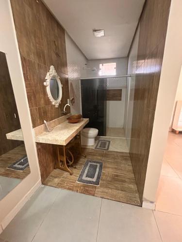 a bathroom with a toilet and a sink and a shower at New progress, it's Félix! in Marabá