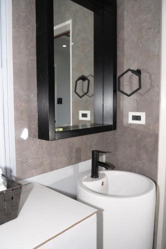 a bathroom with a sink and a mirror at Kingston Horizon Retreat in Kingston