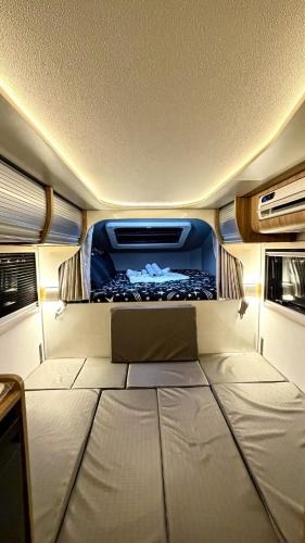 a view of the inside of a rv with a bed at Upgrade Beach Resort Infanta Quezon in Infanta