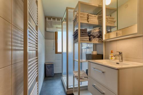 a small bathroom with a sink and a mirror at Nanas-Auszeit in Rothenbuch