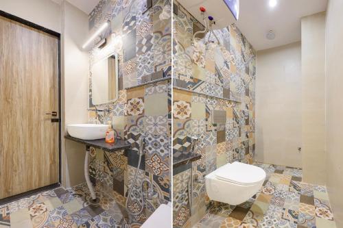 a bathroom with a toilet and a sink at FabHotel RR Inn in Kānpur