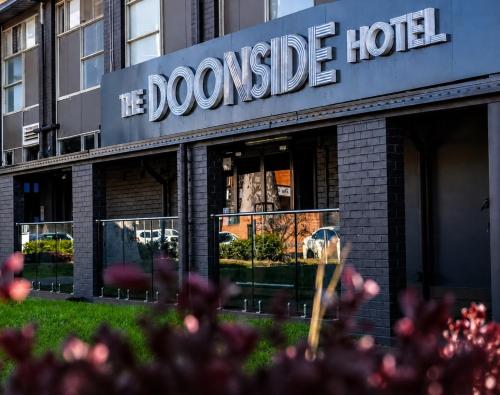 a building with the doomsday hotel written on it at Doonside Hotel, Blacktown in Doonside