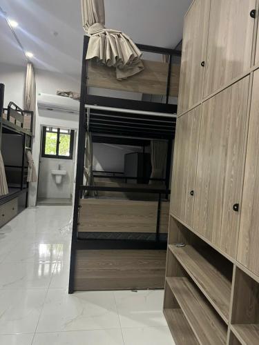 a room with a bunk bed and a toilet at Green Hostel Hanoi 2 in Hanoi