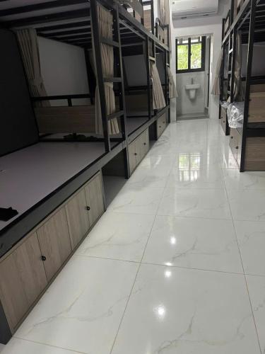 a large room with bunk beds and a toilet at Green Hostel Hanoi 2 in Hanoi