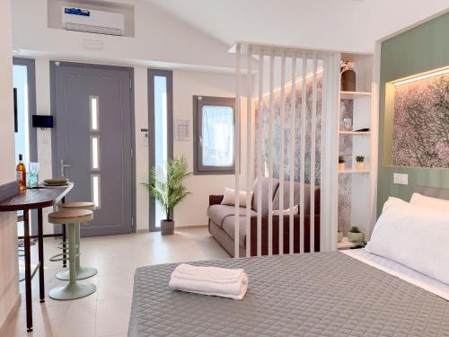 a bedroom with a canopy bed and a couch at Cà in Laguna in Chioggia