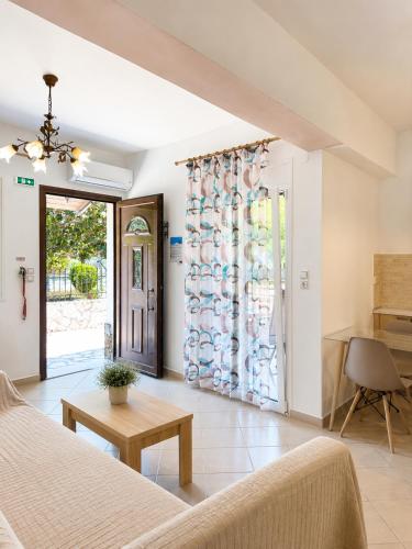 a living room with a couch and a table at Lina's House in Syvota
