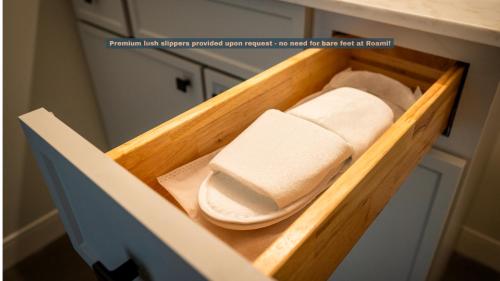 a wooden drawer with some towels in a kitchen at Roami at Century Plaza in Minneapolis