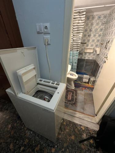 a small bathroom with a toilet in a room at LADY E. in Kavála