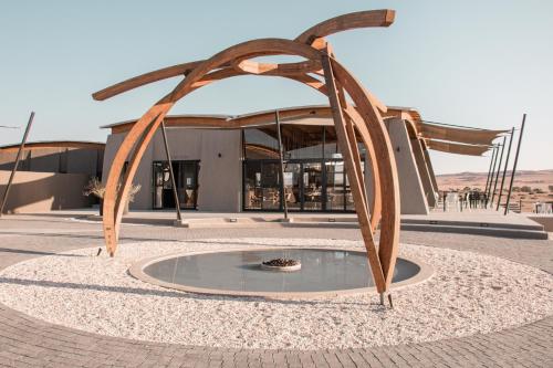 a sculpture of an arch in front of a building at The Desert Grace in Solitaire