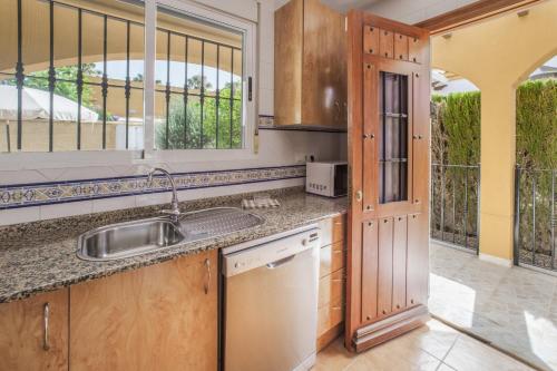a kitchen with a sink and a counter top at Casa Paula in Mazarrón