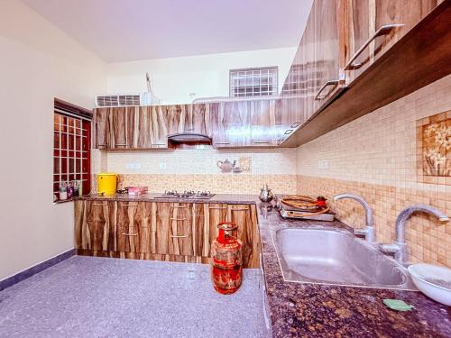 a kitchen with a sink and a counter top at CK Beach House in Chennai