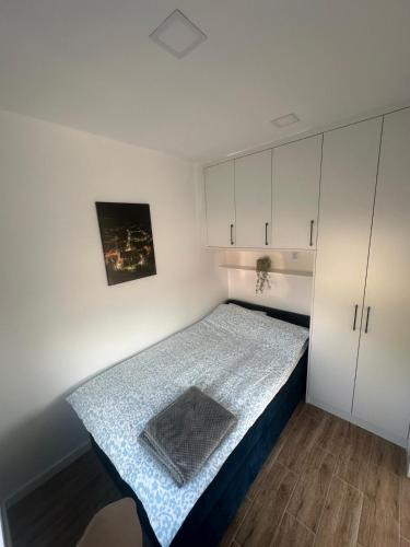 a small bedroom with a bed in a room at Olmar Przybrodzin in Przybrodzin
