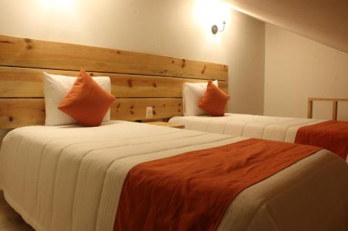 Postel nebo postele na pokoji v ubytování Hotel Palace Inn SCLC