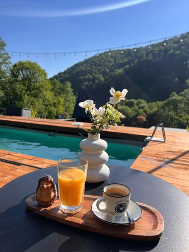 a tray with a drink and a cup of coffee on a table at ACASĂ la Lisa in Lissa