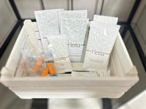 a shelf with a bunch of hygiene products on it at Villa Trevisi - ROOMS -free parking in Treviso