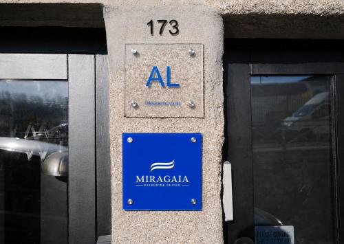 a sign on the side of a building at Miragaia - Riverside Suites - Adults Only in Porto