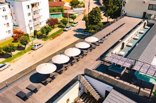 an overhead view of a street with umbrellas at Hotel Spa & Events Imperial Sighișoara in Sighişoara