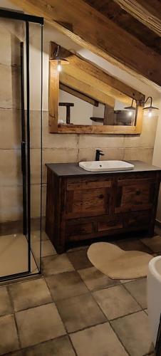 a bathroom with a sink and a mirror at B&B Borgo Saint-Rhémy in Saint-Rhémy-en-bosses