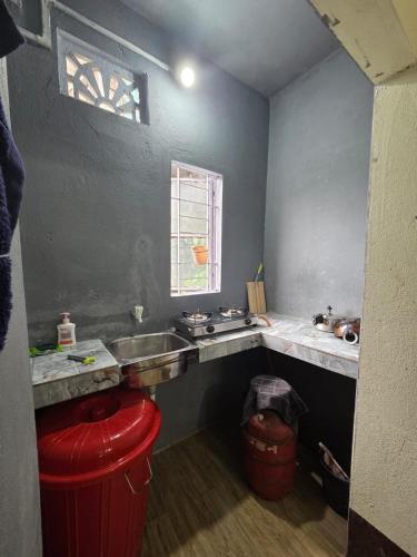 a kitchen with a sink and a counter top at Anigo 3bhk, Itanagar in Itānagar