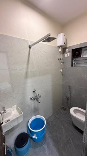 a bathroom with a sink and a toilet at Hotel calm resort in Murud