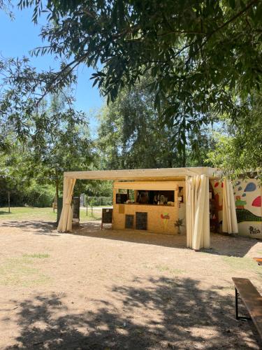 a tent in a park under a tree at Vita Da Pacos in Novilara