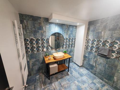 a bathroom with a sink and a mirror at Casa Alina in Nehoiu