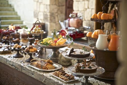 a buffet of desserts and pastries on a table at Torre Del Parco in Lecce