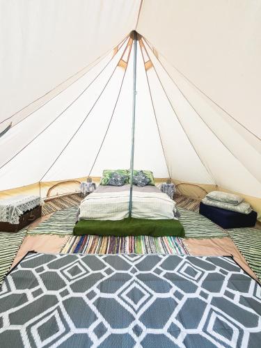 a room with a tent with a bed in it at Lahemaa Nature Glamping - Koit in Vihasoo